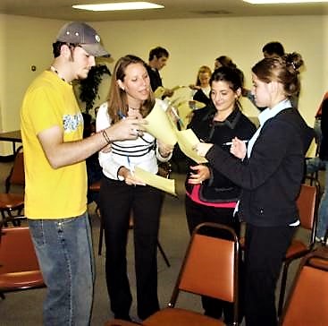 Training participants involved in an icebreaker activity. Source: UNKNOWN (n.y.)